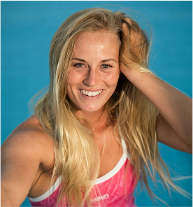 Robin smiling by poolside